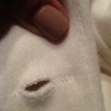 Poor stitching, button will not fit through the holes.