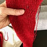 Other color fiber mixed in to right and just above thumb.