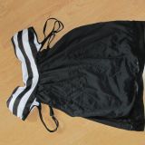 Supposed to be a swimsuit-bodice section sewn on upside down so that the straps hand under the armpits. This was the one I ordered http://www.rosewe.com/strap-design-striped-black-two-piece-swimwear-g149763.html