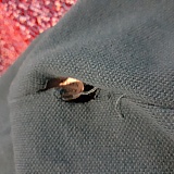 A shirt from Nautica with a hole in the side due to thread coming undone.