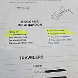 Justfly receipt shows 1st checked bag included