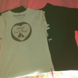 The black shirt is from cafepress, the white shirt infront is from zazzle. They' re both exactly the same size. WTF!