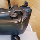 Close up of chairs broken left arm