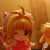 Fake figure as received in my DokiDoki February box. The warm lighting and mobile camera make it difficult to view some abnormalities, but Kero's face is an instant tip-off.