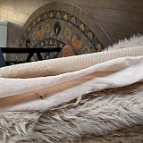 This is another view of the jacket. This rough, itchy, weird material is sewn on the open center of the jacket. It is not anchored down whatsoever. It just hangs out.