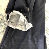 Torn poorly hemmed sleeves