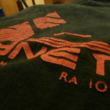 "Skynet" black t-shirt after 2 trip to the washing machines. All the red lines and letter are peeling off at the edges. I easily pulled off the missing ones.