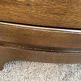 Unfinished wood or scratched all across the bottom of both end tables. More noticeable in person.