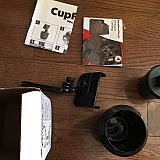 You can see 2 knobs - one where extender adjusts to phone holder and the other that adjusts phone holder width. No way to attach to cup part. I just noticed on my order confirmation it SPECIFICALLY says THREE KNOBS.