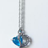 A closeup on the pendant of the necklace.