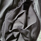 Armhole with unfinished seam.