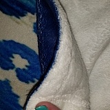 Another company's fleece blanket. Stitching is nearly hidden from the back and totally hidden from the front. No turned under hems. VERY cozy, soft, furry fabric that keeps you warm. Because stitching is done so well and there's no hem, blanket looks