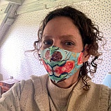 A customer from France wearing a facemask with a design from one of my paintings.