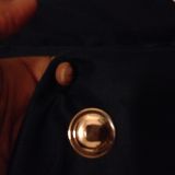 I could bare get the tip of my finger through that hole, let alone a button.