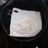 The package arrived 2-months later and for my coat, the envelope fit in the center of my Ford Focus steering wheel.
